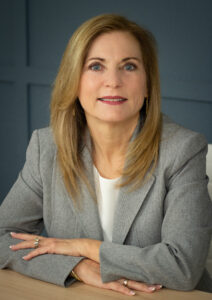 Headshot of Patty Lavely from the chest up wearing a gray blazer.